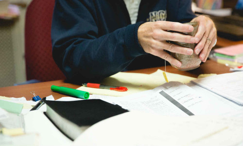 A Bible and Theology professor in his office.