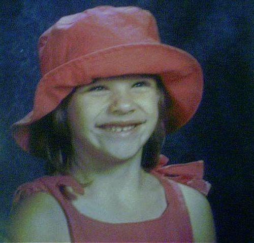 Girl with red bucket hat