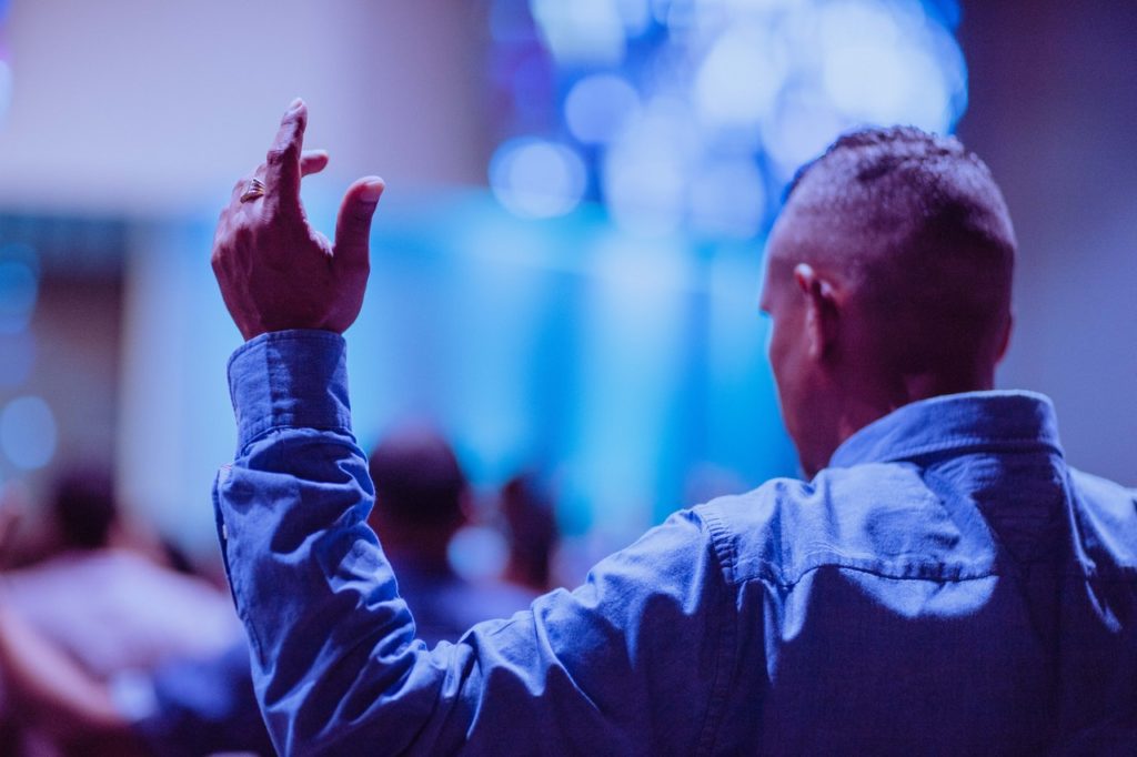 Man worshipping in church